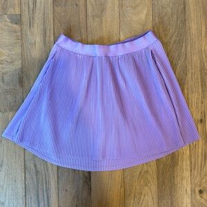 Girls All in motion skort with pockets. Size XL (14) purple new without tags.